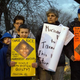 People display signs at Cudell Commons Park in Cleveland Nov. 24, 2014, during a rally for Tamir Rice.
JORDAN GONZALEZ/AFP/Getty Images